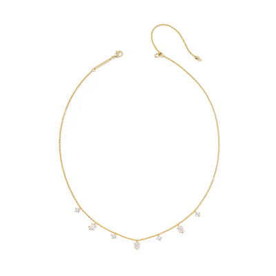 Gold necklace with small diamonds on a white background